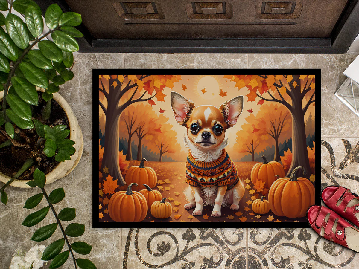 Decorative doormat with a dog in a sweater and pumpkins design on a patterned floor.