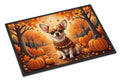 Decorative mat with a dog in a sweater surrounded by pumpkins and autumn leaves.