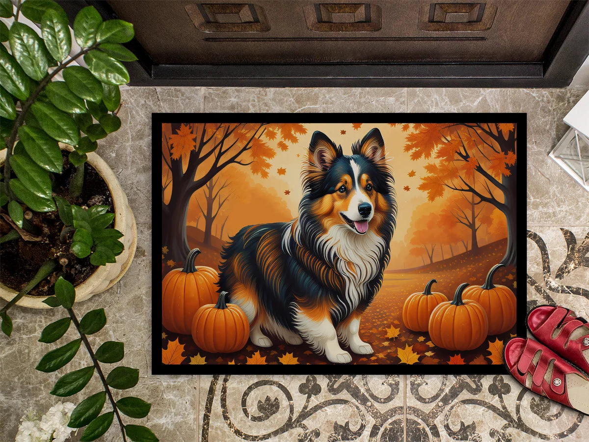 Doormat with a dog and pumpkins design on a textured floor.