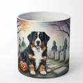 Candle with a dog and Halloween-themed design on a white background