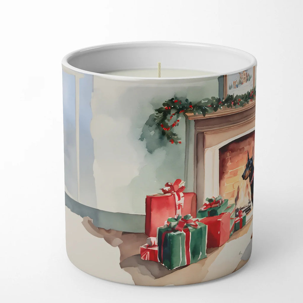 Candle with a Christmas-themed design featuring presents and a fireplace on a white background