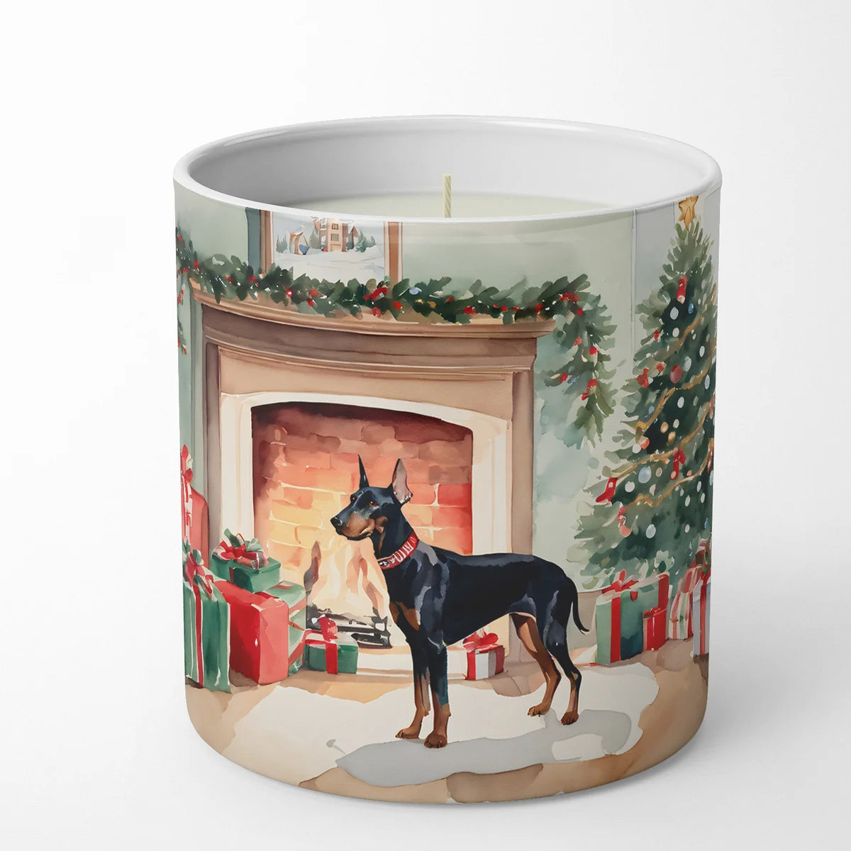 Candle with a Christmas-themed design featuring a dog by a fireplace and tree.