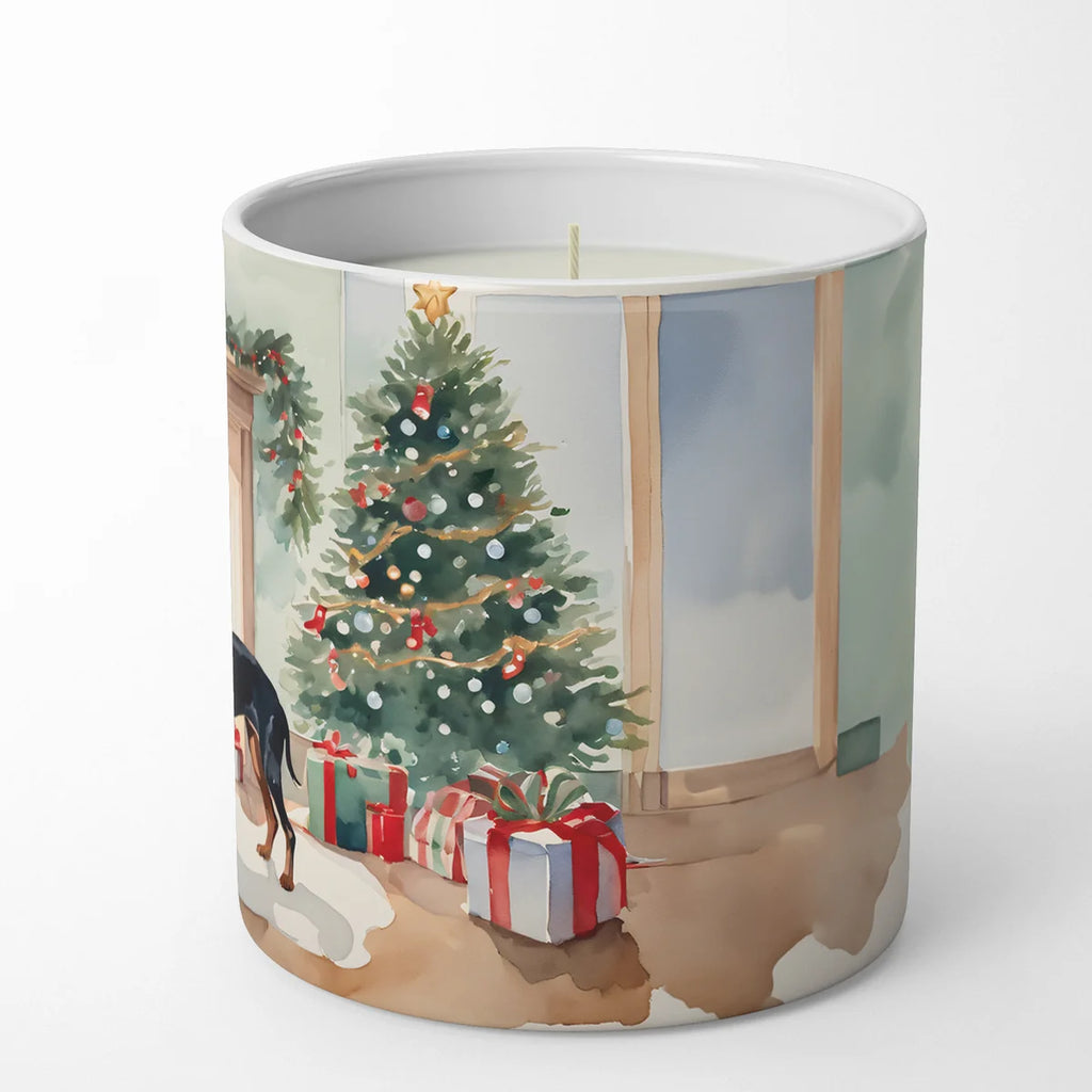 Candle with a Christmas scene design featuring a tree and presents.