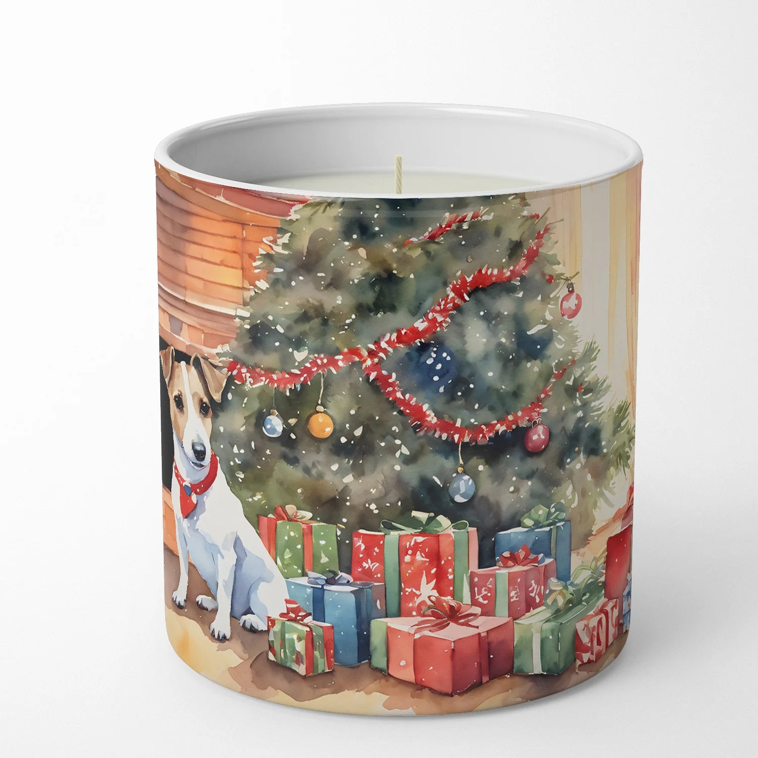 Candle with a Christmas design featuring a dog and decorated tree on a white background