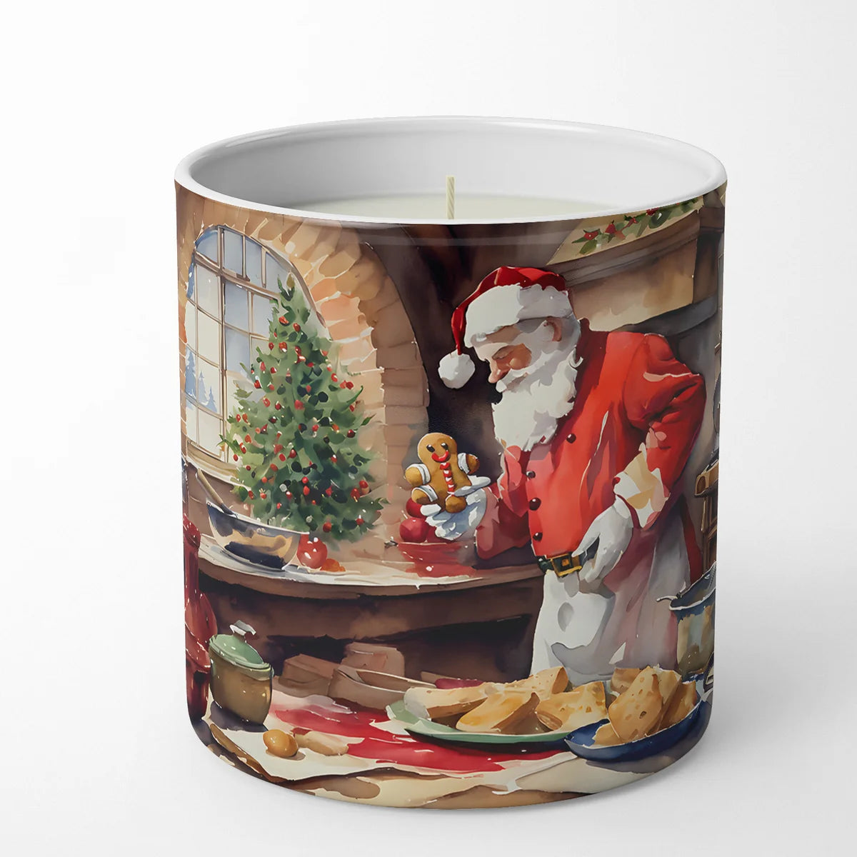 A white ceramic candle jar with a printed illustration of Santa Claus in a cozy holiday kitchen scene, featuring a Christmas tree, cookies, and warm lighting.