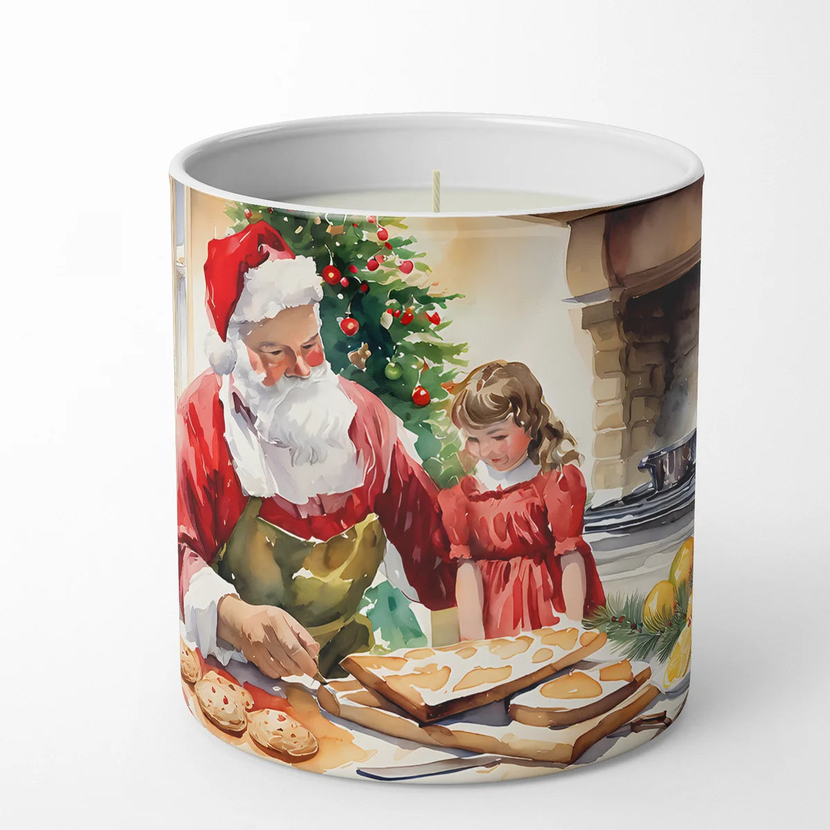 Candle with a design of Santa Claus and a child baking cookies in front of a Christmas tree.