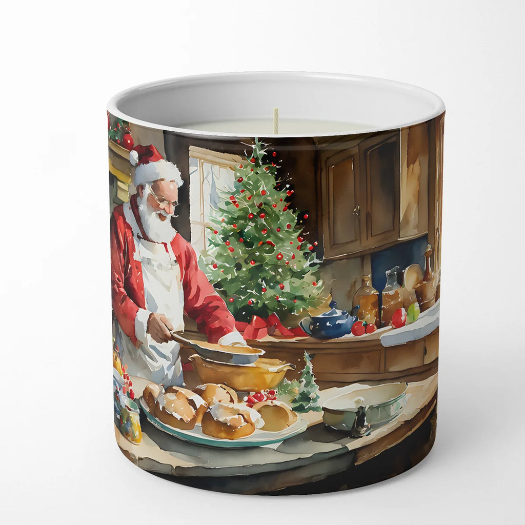A cylindrical candle jar featuring a festive Christmas watercolor illustration of Santa Claus baking pastries in a decorated kitchen, shown on a clean white background.