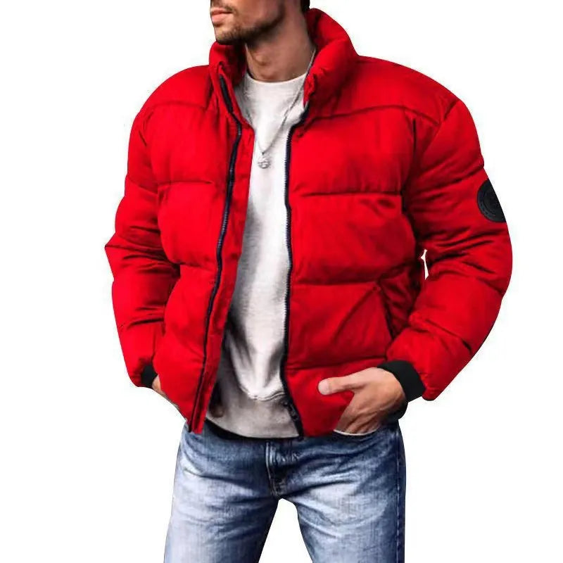 Red puffer jacket worn by a person on a white background