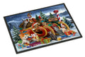 A rectangular black-framed art print or mat featuring a festive Christmas scene with dogs in a sleigh carrying wrapped gifts, set against snowy mountains and evergreen trees under a starry night sky.
