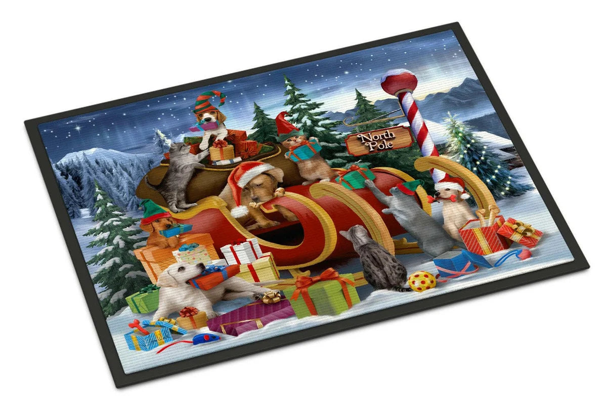 A rectangular black-framed art print or mat featuring a festive Christmas scene with dogs in a sleigh carrying wrapped gifts, set against snowy mountains and evergreen trees under a starry night sky.