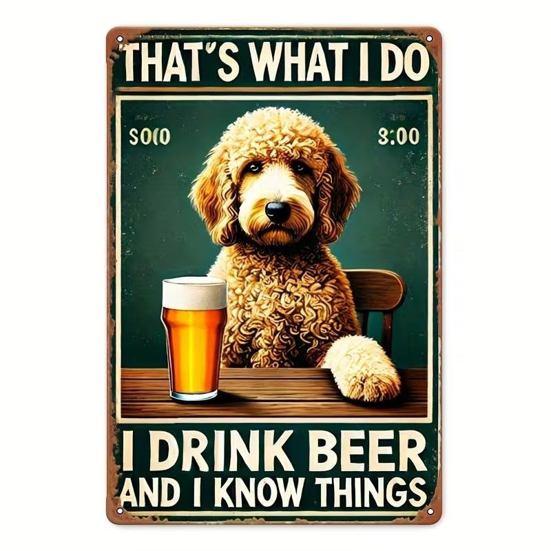 A rectangular metal-style novelty sign with rounded corners and visible screw holes, featuring a cartoon dog sitting at a table with a glass of beer and the text 'THAT'S WHAT I DO' at the top and 'I DRINK BEER AND I KNOW THINGS' at the bottom.